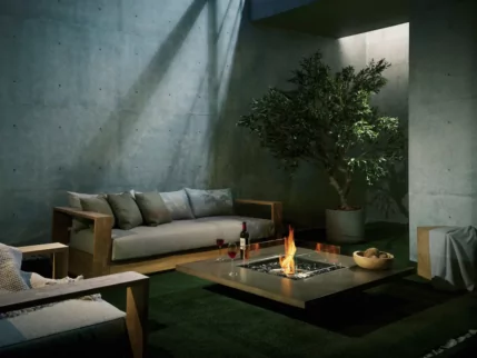 EcoSmart Fire Vertigo 50 Fire Table adds bioethanol warmth to a natural concrete patio at a Japanese private residence, inviting relaxed outdoor living.