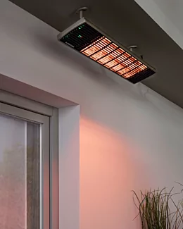 Heatscope Heaters Spot 2800W Radiant Heater wall-mounted on a restaurant terrace, outdoor electric infrared heating in Commercial Space.