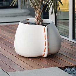 Blinde Design Stitch 50 Planter in bone concrete enriches the Starfire patio deck with modern outdoor planter style for residential living.