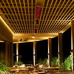Heatscope Heaters Vision 3200W Radiant Heater wall‑mounted outdoors on a restaurant terrace, electric infrared heating.
