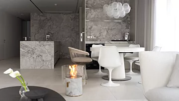 EcoSmart Pillar 3L Designer Fireplace adds elegant marble ethanol warmth to residential dining rooms in South Korea, enhancing modern home ambience.