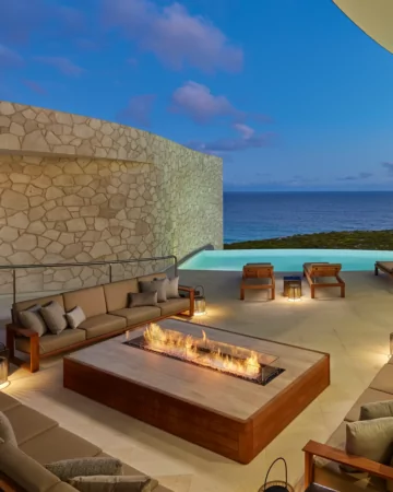 EcoSmart Fire Linear 90 Fire Pit Kit frames Southern Ocean Lodge’s terrace seating with a clean-burning bioethanol flame line.